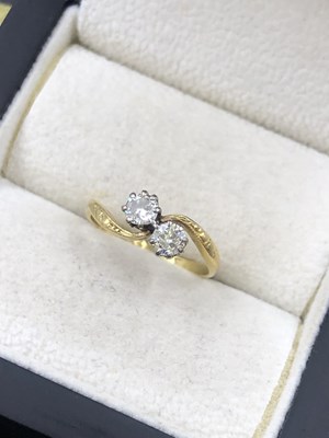 Lot 570 - A vintage 18ct and platinum two-stone to et...