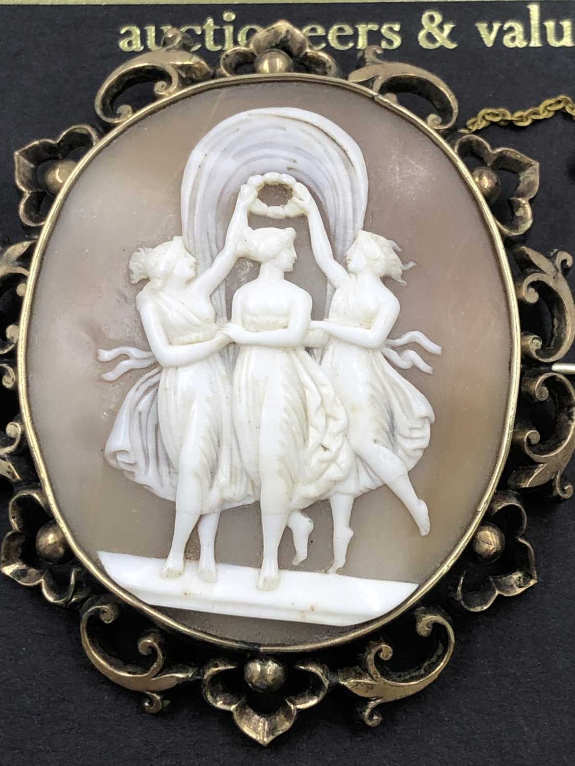 Lot 617 - A large antique carved shell cameo brooch in a...
