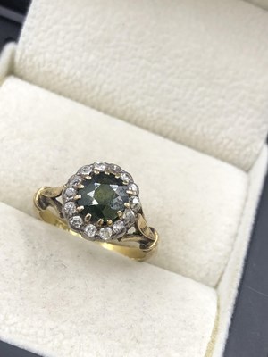Lot 622 - A vintage green gem set and diamond cluster...