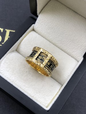 Lot 625 - An 18ct hallmarked gold and black enamel...