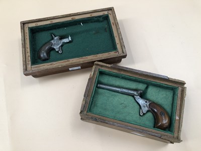 Lot 490 - Two antique blank-firing gallery pistol parts.