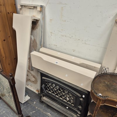 Lot 137 - A cast iron solid fuel stove /room heater and...