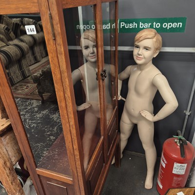 Lot 144 - A vintage child mannequin and a display cabinet.