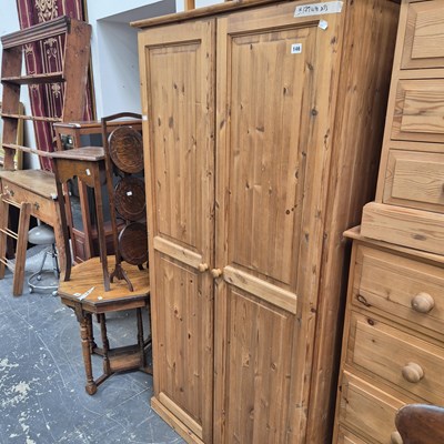 Lot 146 - A pine two door wardrobe.