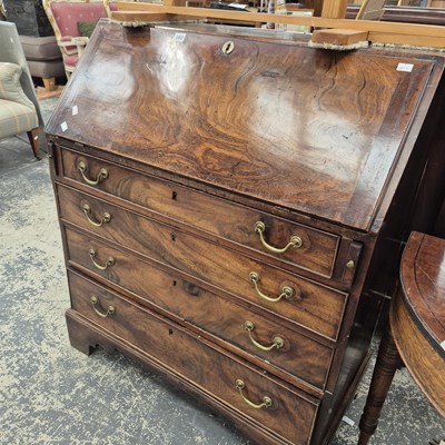 Lot 162 - A Geo. III mahogany bureau.