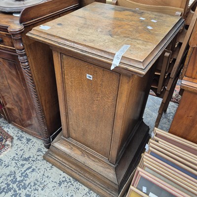 Lot 184 - An antique oak display pedestal