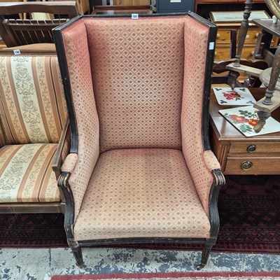 Lot 197 - An antique high wing back armchair with...