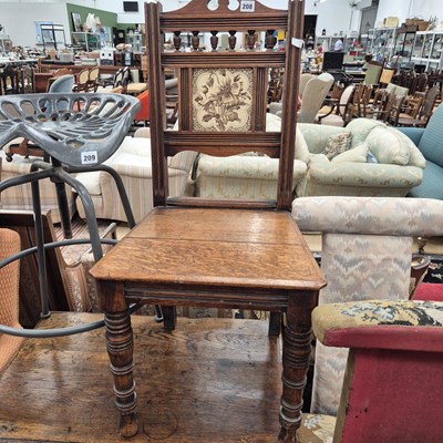 Lot 208 - A Victorian oak hall chair with inset tile back.