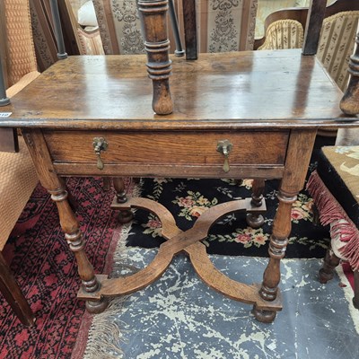 Lot 210 - An antique oak side table with frieze drawer...