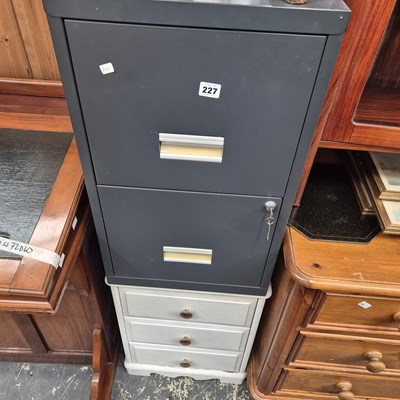 Lot 227 - A filing cabinet and a small three drawer...