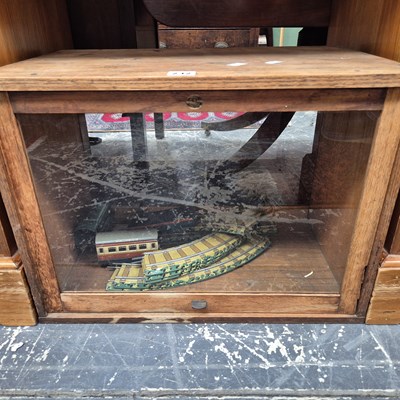 Lot 232 - A table top display case and vintage tinplate...