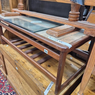 Lot 234 - A teak tile topped coffee table.