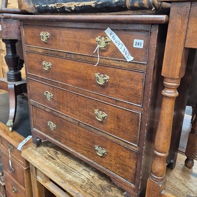 Lot 241 - A 19th century oak small four drawer chest. 73...