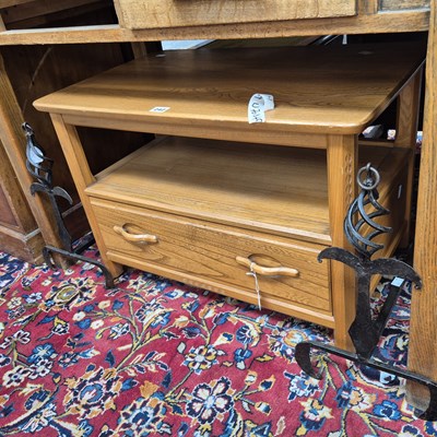 Lot 242 - A coffee table and a pair of fire dogs.