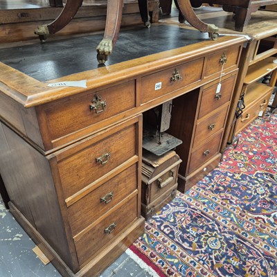 Lot 243 - An Edwardian twin pedestal desk  107 x 54 x 78...