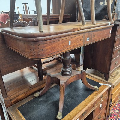 Lot 244 - A William IV mahogany fold-over card table.