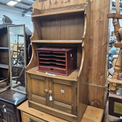 Lot 250 - An ercol mid elm small bookcase and a...