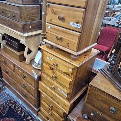 Lot 255 - Three pine bedside chests.