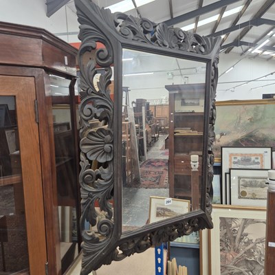 Lot 264 - An antique carved oak framed wall mirror. 82 x...