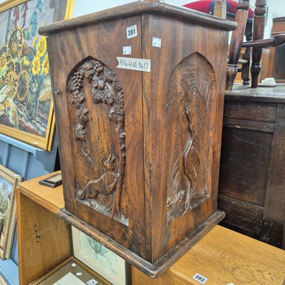 Lot 281 - An interesting hand-carved elm cabinet.