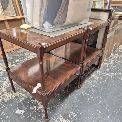 Lot 283 - A pair of mahogany two tier end tables.