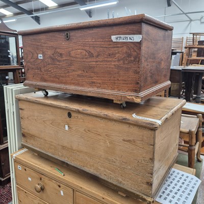 Lot 284 - An antique elm lift-top box and a pine blanket...