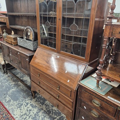 Lot 300 - An early 20th-century mahogany bureau-bookcase...