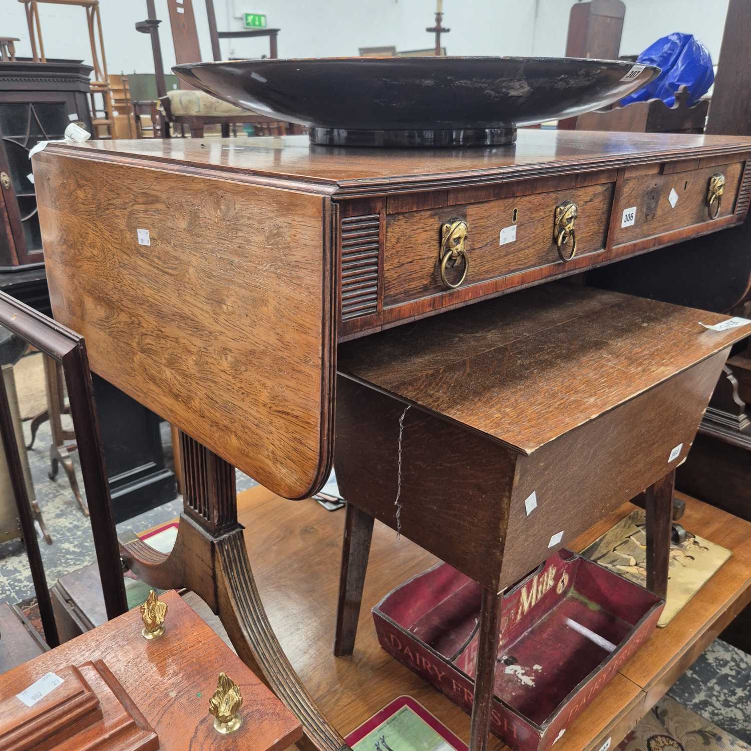 Lot 306 - A Regency mahogany sofa table on splay sabre...