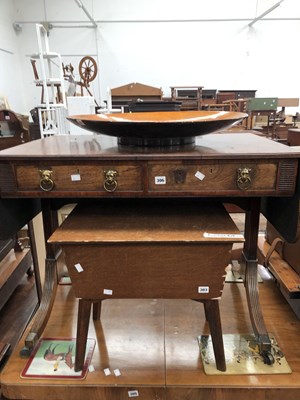 Lot 306 - A Regency mahogany sofa table on splay sabre...