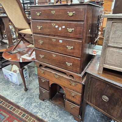 Lot 320 - A Georgian oak kneehole desk and a small...