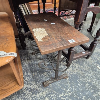Lot 321 - A small coffee table with iron base