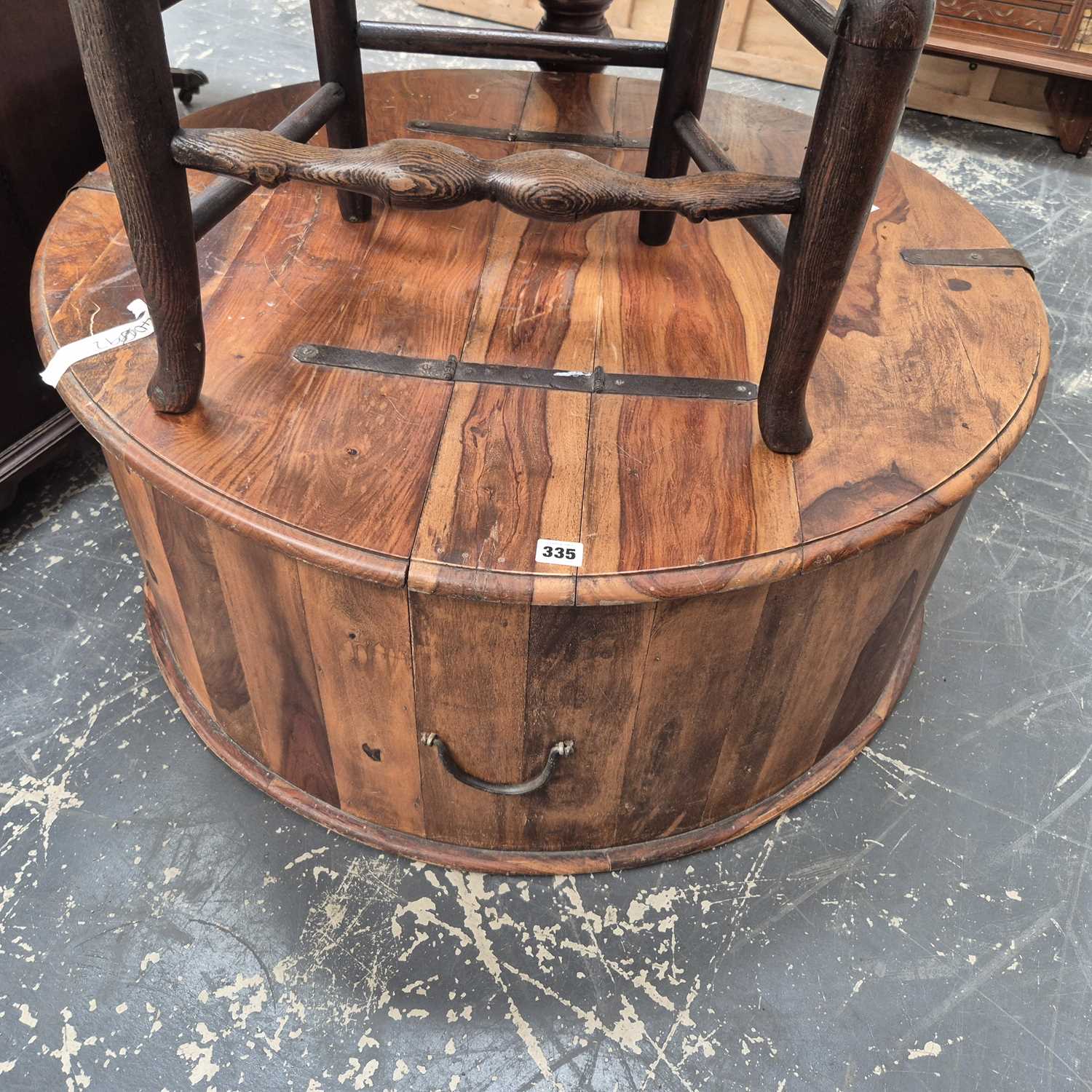 Lot 335 - A hardwood lift-top coffee table box 92 cm dia...