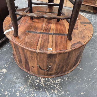 Lot 335 - A hardwood lift-top coffee table box 92 cm dia...
