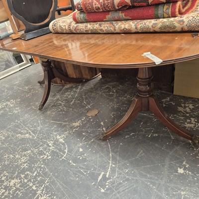 Lot 337 - A mahogany twin pedestal dining table.