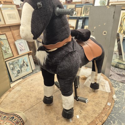 Lot 340 - A walk-along toy horse.