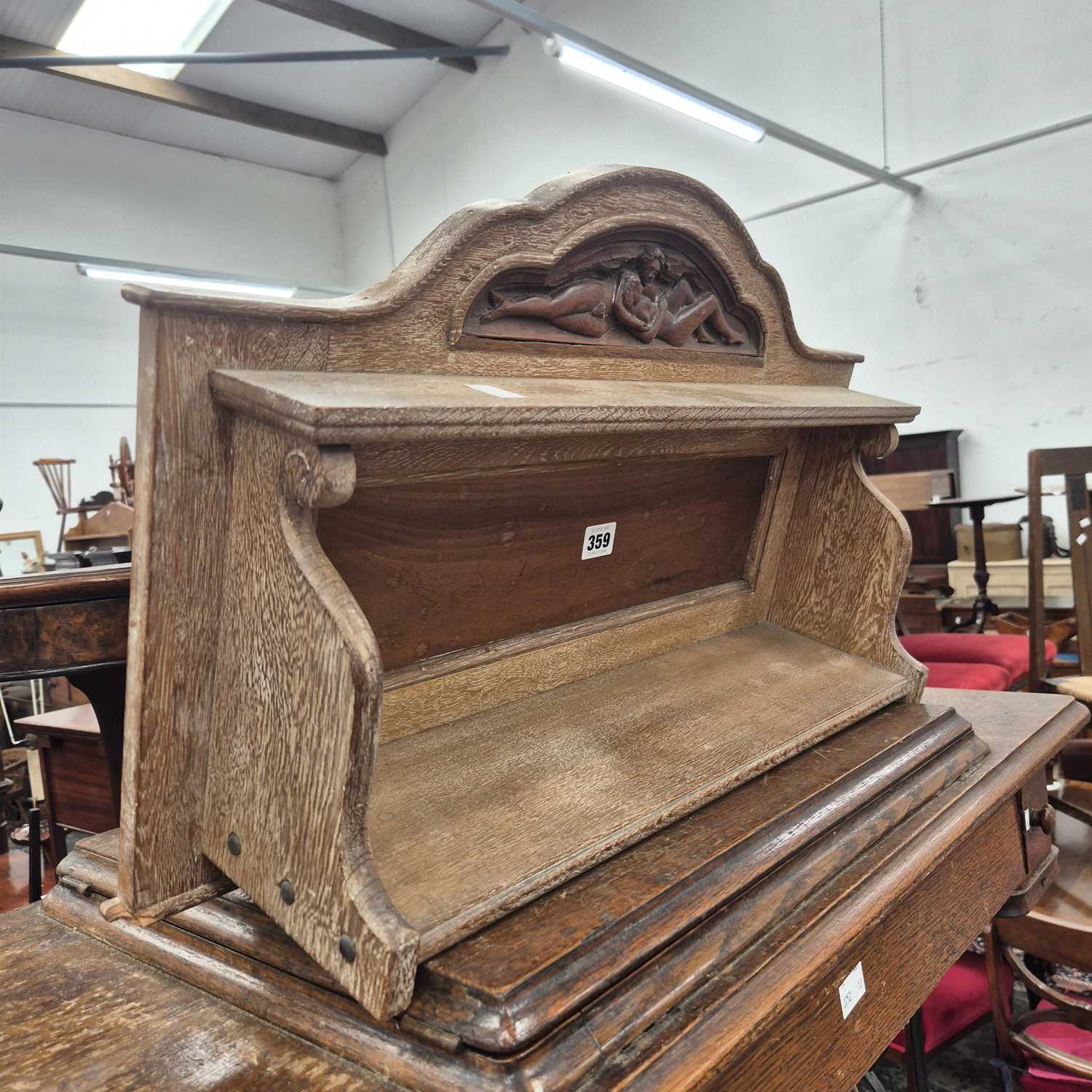Lot 359 - An antique carved wall shelf