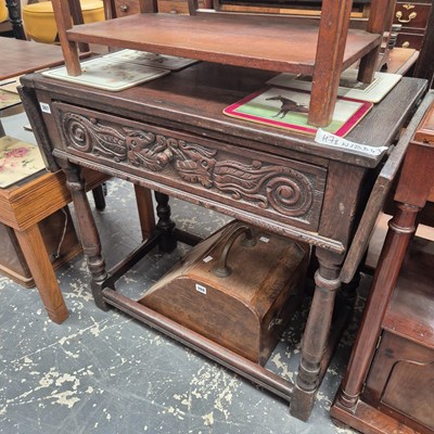 Lot 367 - A carved oak hall table.