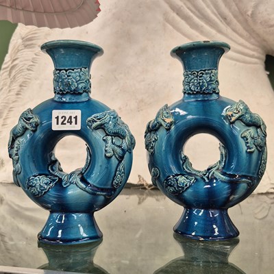 Lot 1241 - A pair of Chinese blue glazed ring form vases...