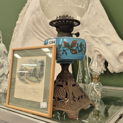 Lot 1244 - An oil lamp with a turquoise glass receiver...