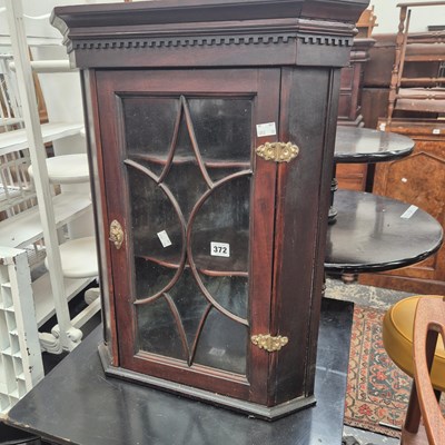 Lot 372 - A small corner cabinet