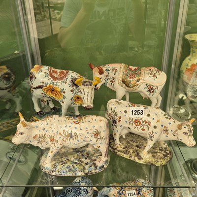 Lot 1253 - Four 19th century polychrome Delft figures of...