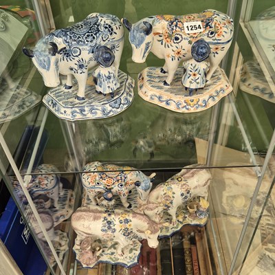 Lot 1254 - Five 19th century polychrome Delft figires of...