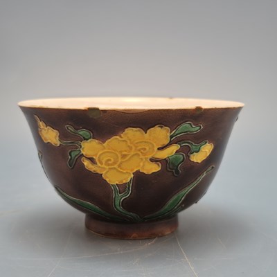 Lot 1412 - A fahua aubergine ground bowl, painted with...