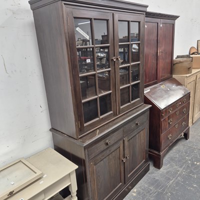 Lot 445 - An antique glazed bookcase cabinet