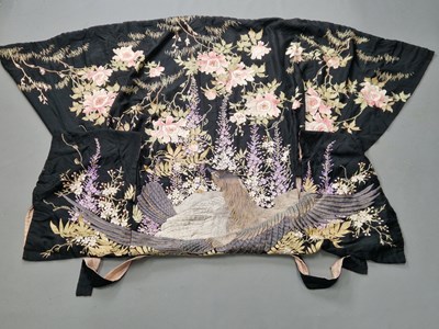 Lot 1414 - A Japanese black ground silk kimono...