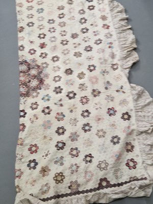 Lot 1415 - An early 19th century patchwork quilt worked...