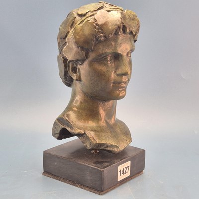 Lot 1427 - A green patinated bronze head of a Bacchus,...