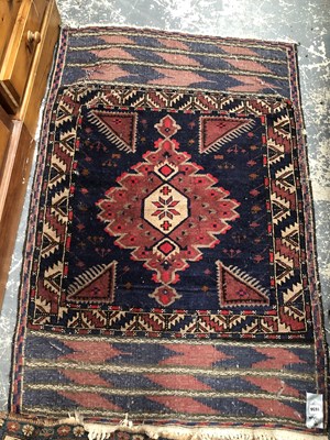 Lot 1656 - An antique Belouch tribal rug, 135 x 92cms