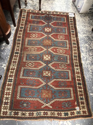 Lot 1660 - An antique caucasian Kazak rug, 200 x 117cms