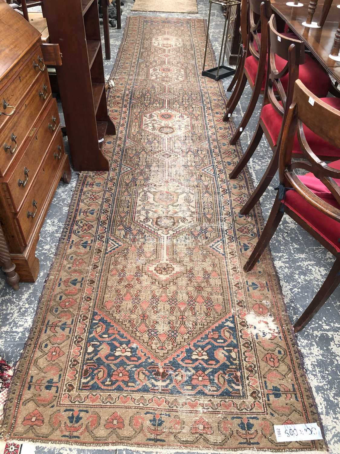 Lot 1662 - An antique Persian Hamadan runner, 500 x 100cms